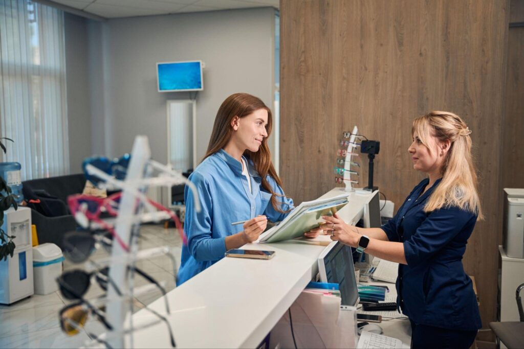 Patient checking in at the front desk for a dentist appointment in Bradenton.